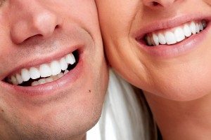 Close up of man and women smiling side by side,Foundations of Health Dental Care, Dentist St. Joseph, MO